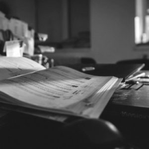 black and white project binder on a desk