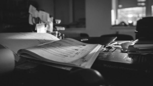 black and white project binder on a desk